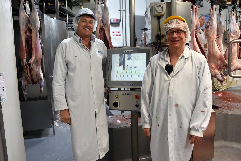 Will Barton, CEO of Gundagai Meat Processors, and lamb floor manager, Jason Crane, with the plant's DEXA unit which measures lean carcase yield.